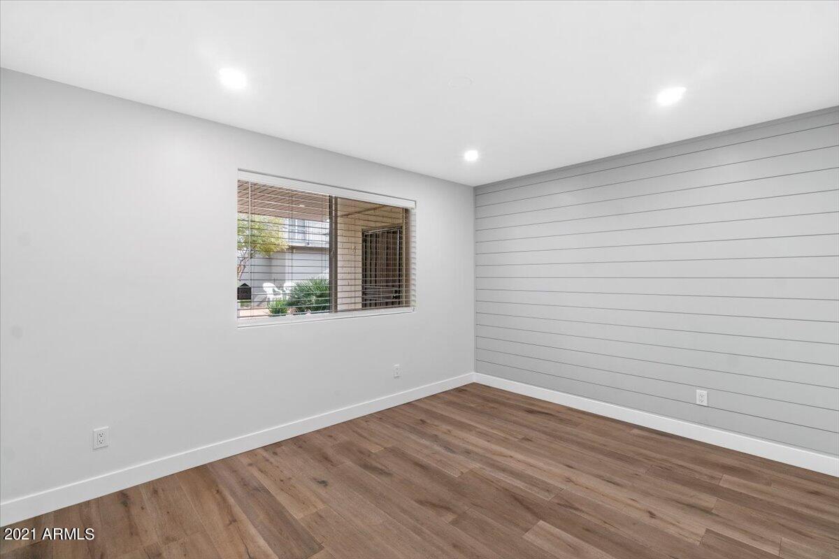 4041 East Camelback Road, Unit 2 Phoenix, AZ 85018 - Photo 17 of 25 wooden floor in an empty room with a window