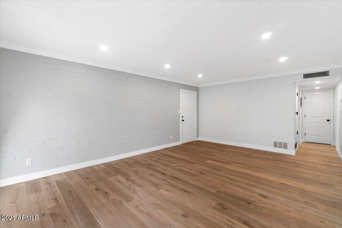 4041 East Camelback Road, Unit 2 Phoenix, AZ 85018 - Photo 23 of 25 a view of an empty room with wooden floor