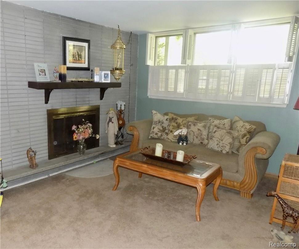 1817 Middle Trail Road Walled Lake, MI 48390 - Photo 8 of 28 LIVING ROOM BOASTS A NATURAL FIRE PLACE