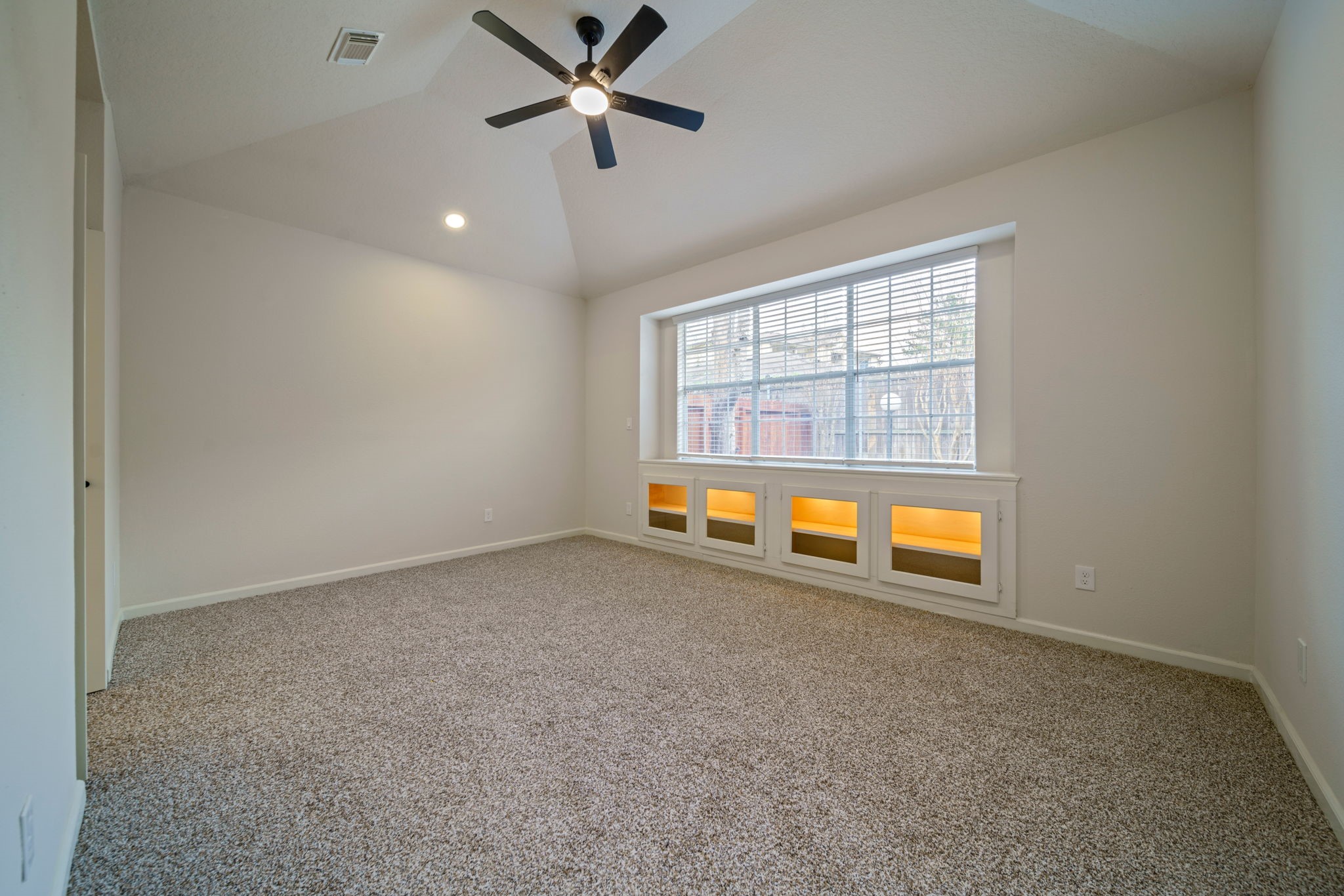 14420 Walters Road, Unit 50 Houston, TX 77014 - Photo 12 of 23 an empty room with a ceiling fan and window