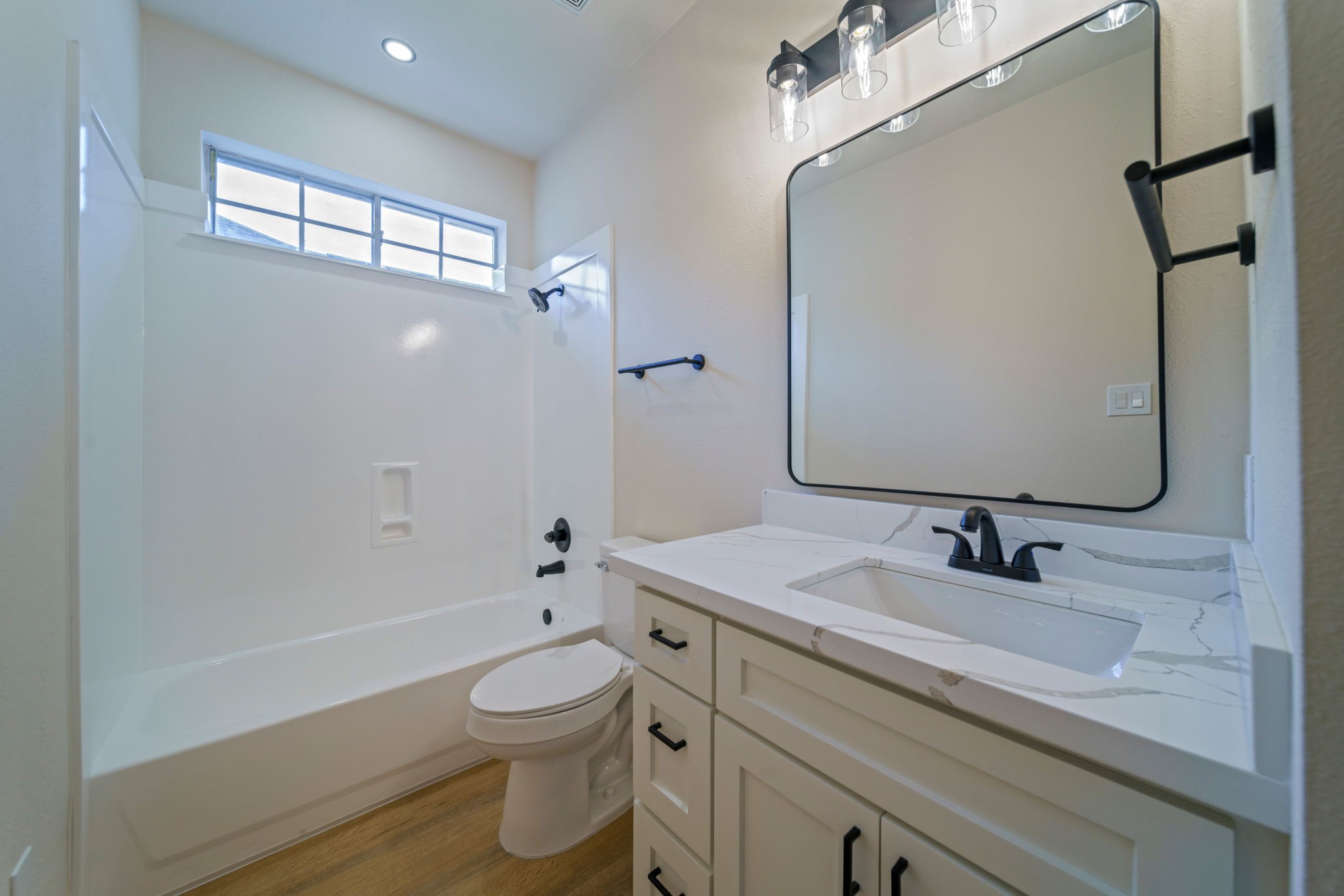 14420 Walters Road, Unit 50 Houston, TX 77014 - Photo 20 of 23 a bathroom with a sink a toilet and shower