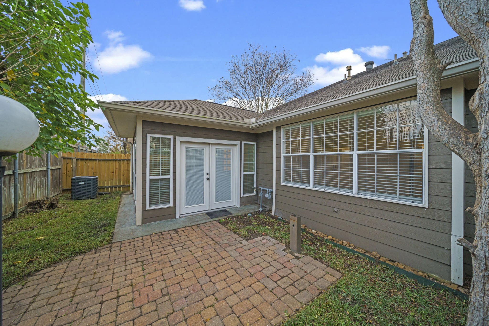 14420 Walters Road, Unit 50 Houston, TX 77014 - Photo 21 of 23 a front view of a house with a yard