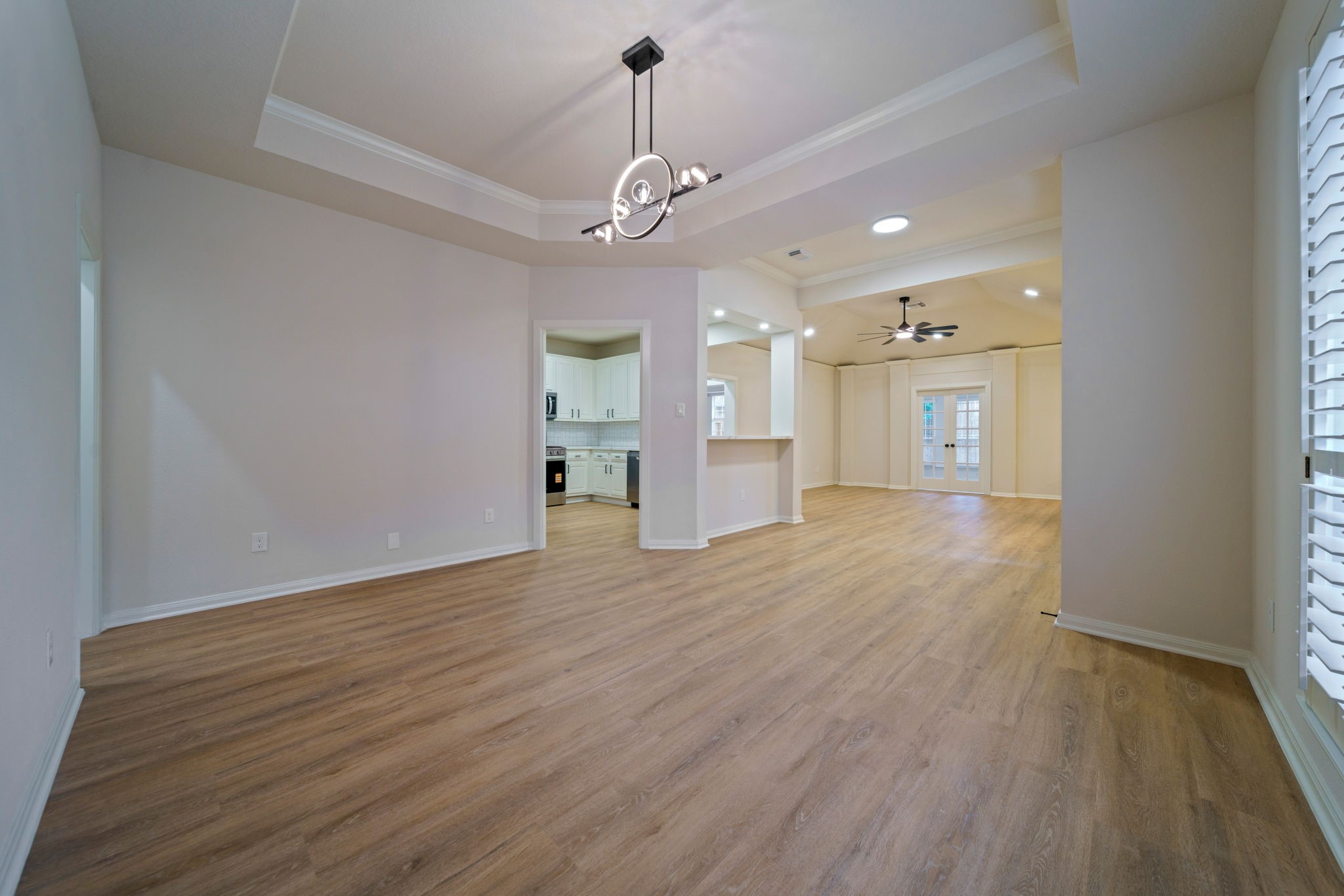 14420 Walters Road, Unit 50 Houston, TX 77014 - Photo 5 of 23 a view of an empty room with wooden floor and windows