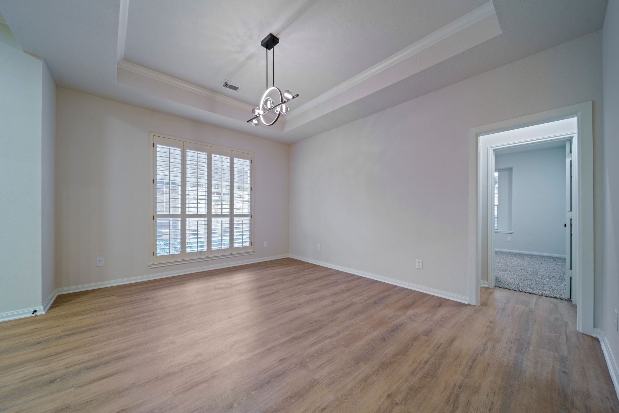 14420 Walters Road, Unit 50 Houston, TX 77014 - Photo 6 of 23 a view of an empty room with wooden floor and a window