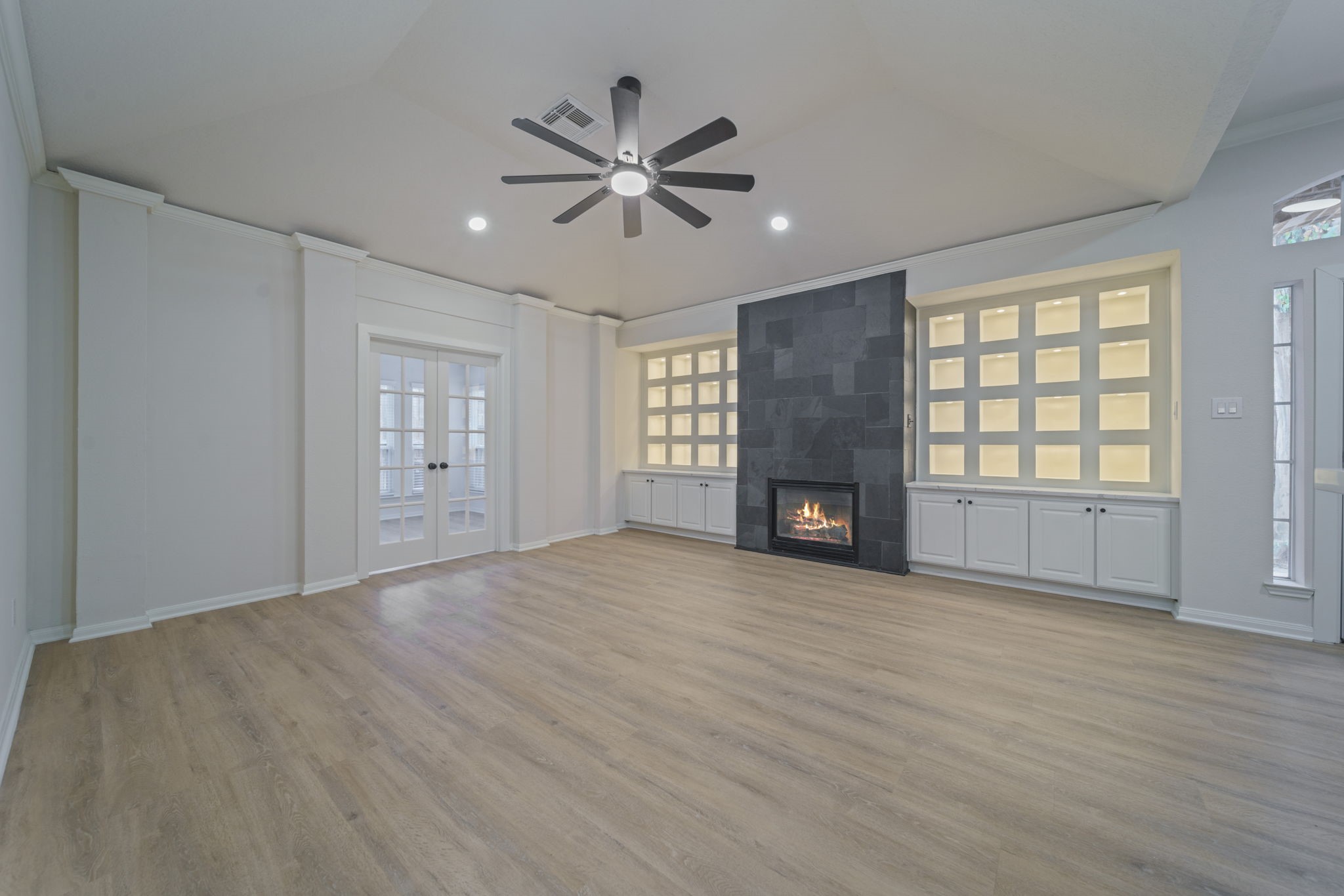 14420 Walters Road, Unit 50 Houston, TX 77014 - Photo 7 of 23 a view of an empty room with window and wooden floor