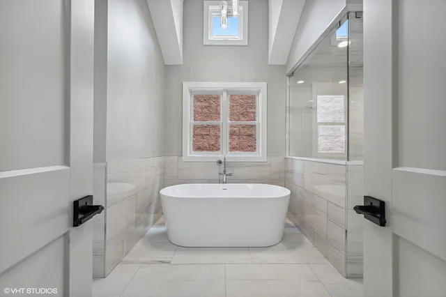 a view of staircase with white walls and cabinets