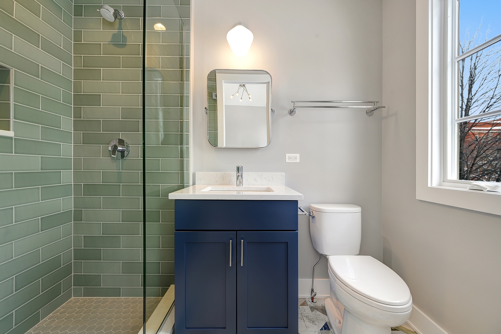 3302 North Hoyne Avenue Chicago, IL 60618 - Photo 20 of 27 a bathroom with a toilet sink vanity shower and mirror
