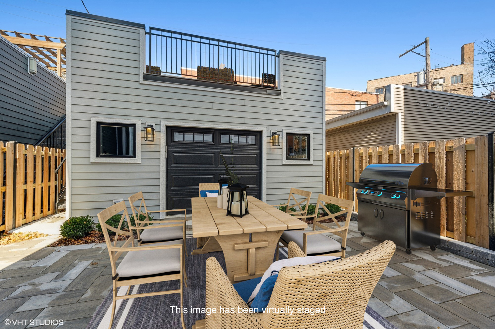 3302 North Hoyne Avenue Chicago, IL 60618 - Photo 26 of 27 a view of a patio with couches and a table