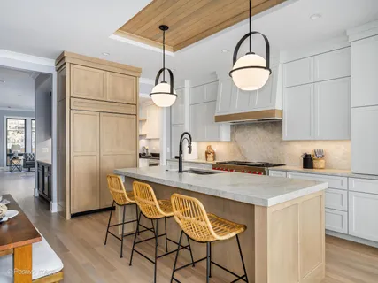 a kitchen with a sink and a stove top oven