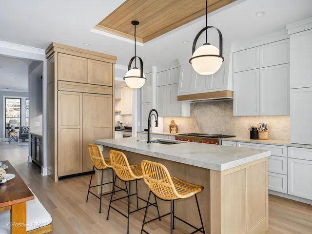 a kitchen with a sink and a stove top oven