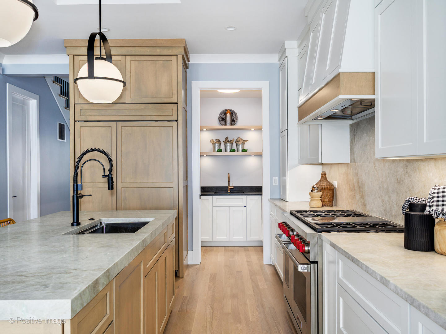 3302 North Hoyne Avenue Chicago, IL 60618 - Photo 7 of 27 a kitchen with a sink and a stove top oven