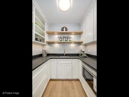 a spacious bedroom with a bed and a couch