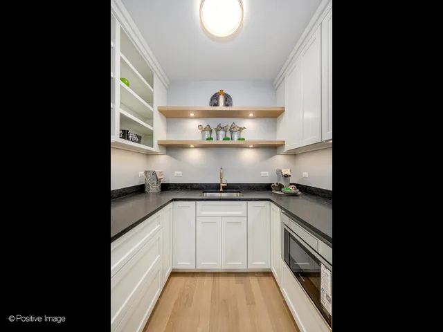 a spacious bedroom with a bed and a couch