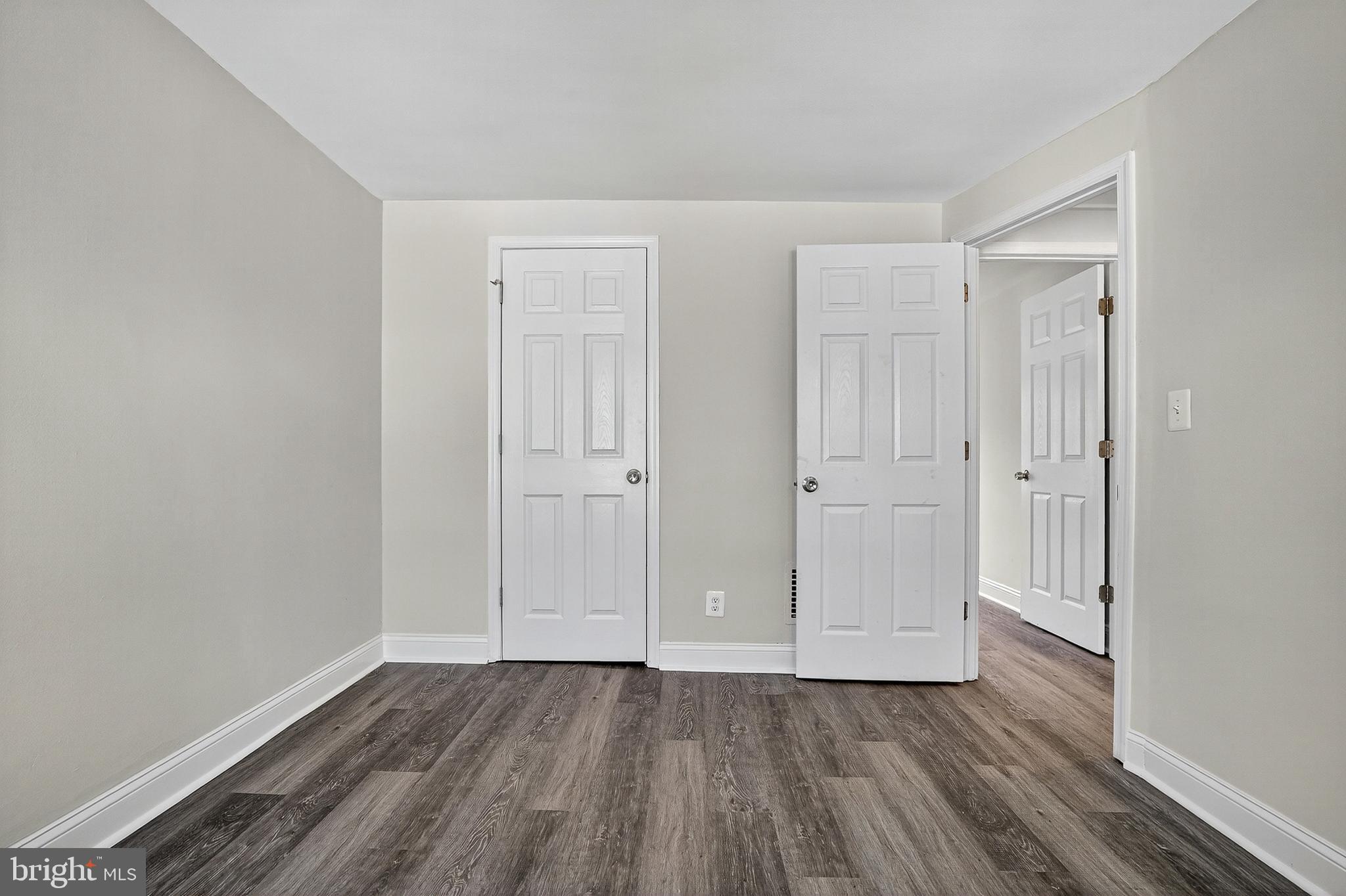 4203 Morrison Court Curtis Bay, MD 21226 - Photo 17 of 23 a view of an empty room with wooden floor