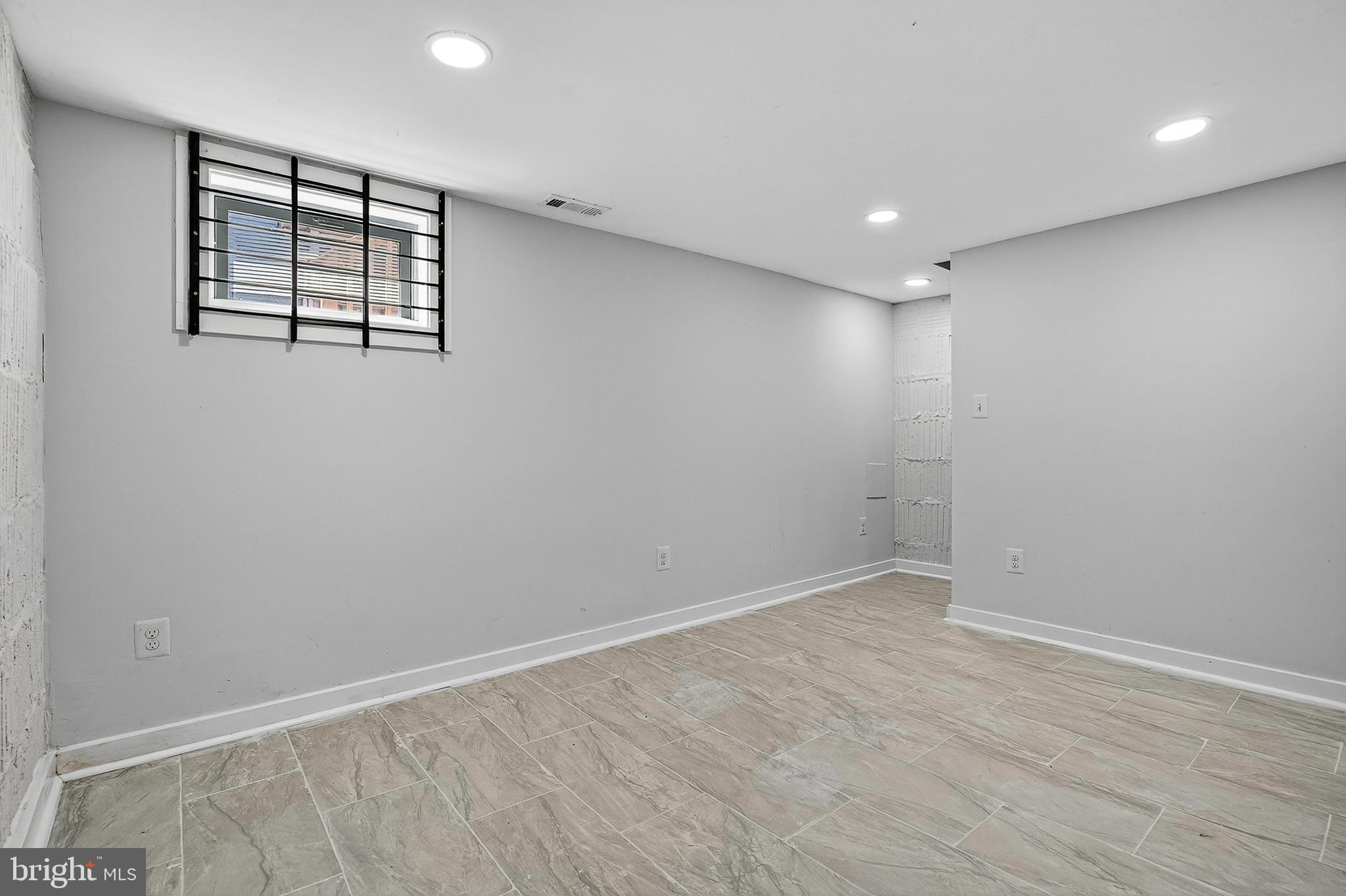 4203 Morrison Court Curtis Bay, MD 21226 - Photo 20 of 23 wooden floor in an empty room with a window