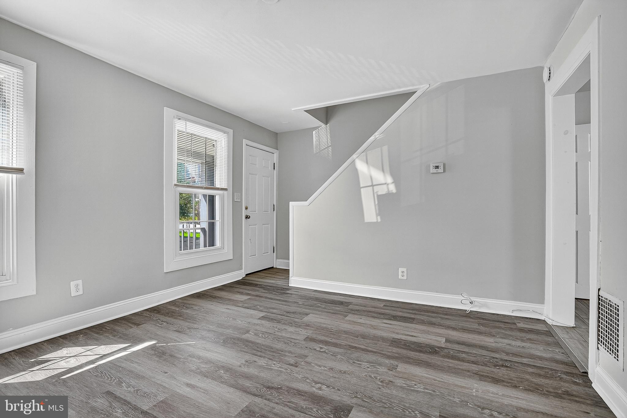 4203 Morrison Court Curtis Bay, MD 21226 - Photo 2 of 23 a view of an empty room with wooden floor and a window
