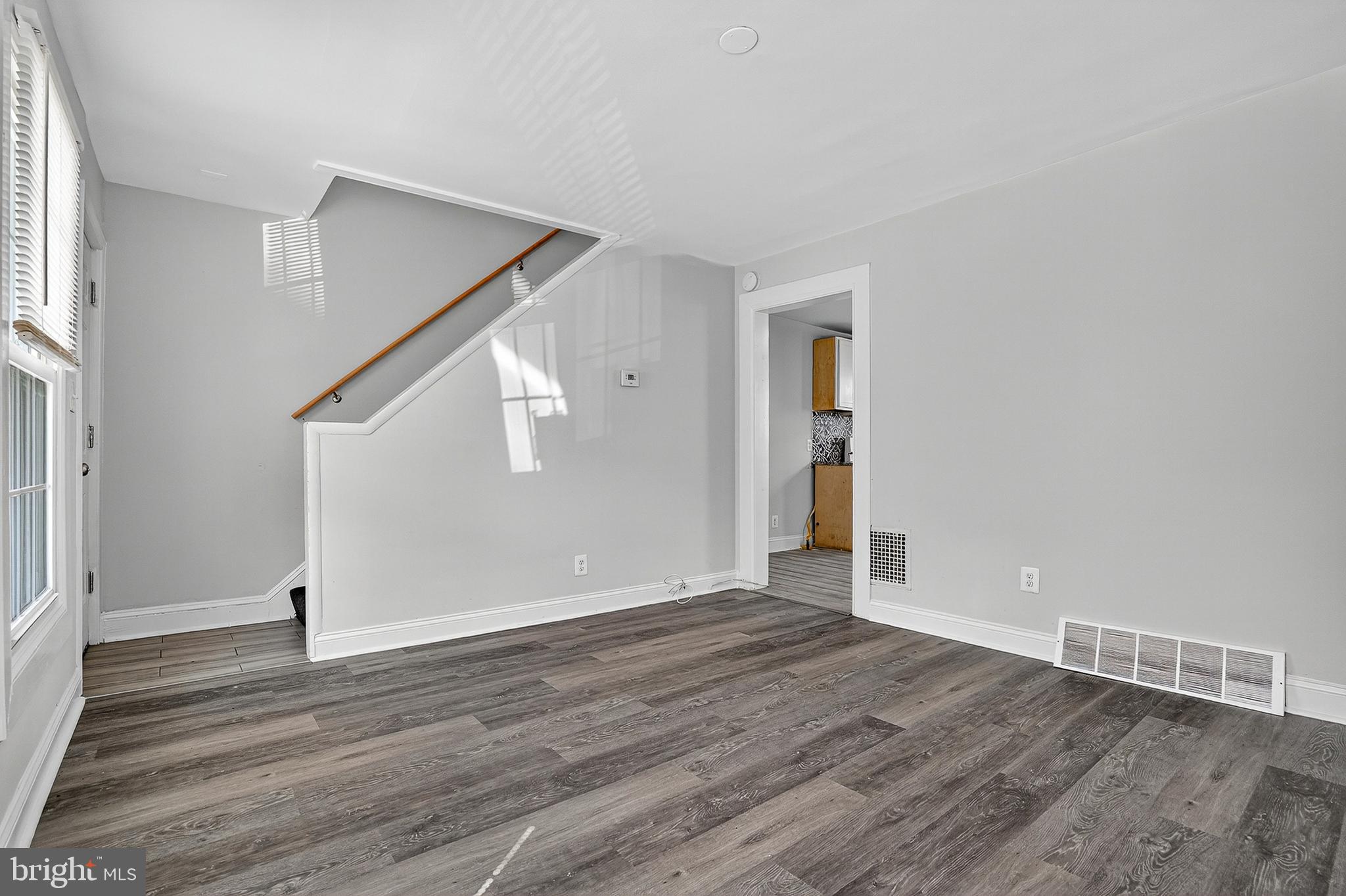 4203 Morrison Court Curtis Bay, MD 21226 - Photo 3 of 23 a view of an empty room with wooden floor and a window
