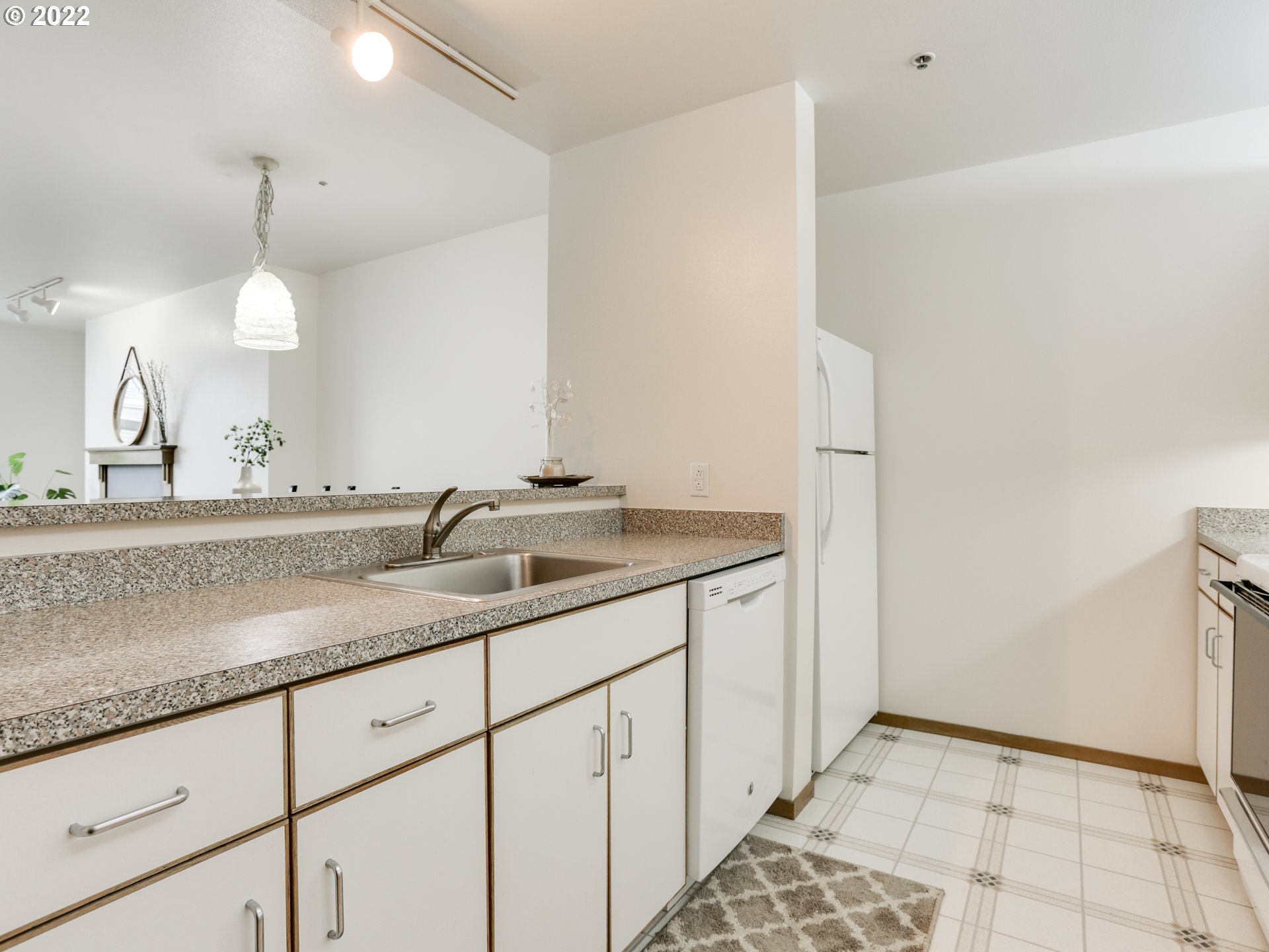 1730 South Harbor Way, Unit 405 Portland, OR 97201 - Photo 8 of 32 a bathroom with a sink and a mirror