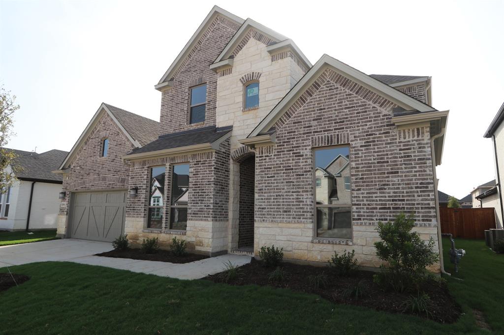 506 Chatham Street Oak Point, TX 75068 - Photo 1 of 1 a view of a brick house with a yard