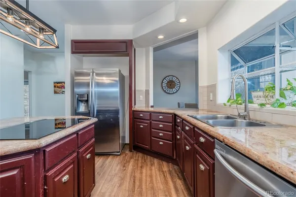 a kitchen with a sink and a refrigerator