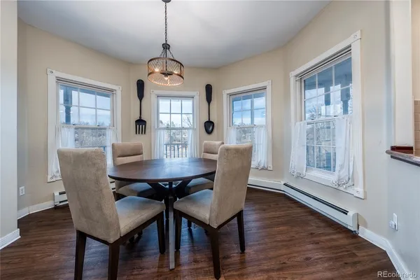 a dining room with furniture window wooden floor