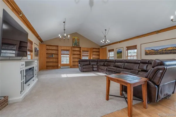 a view of a livingroom with furniture and furniture