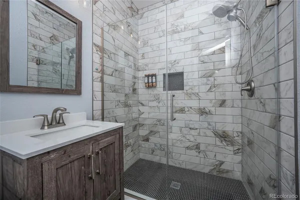 a bathroom with a sink and a mirror