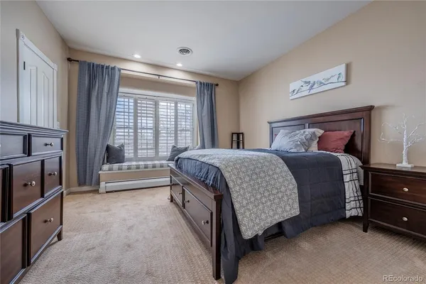 a bed room with a bed and a television