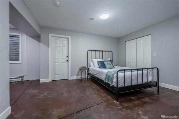 a bed sitting in a room next to a window