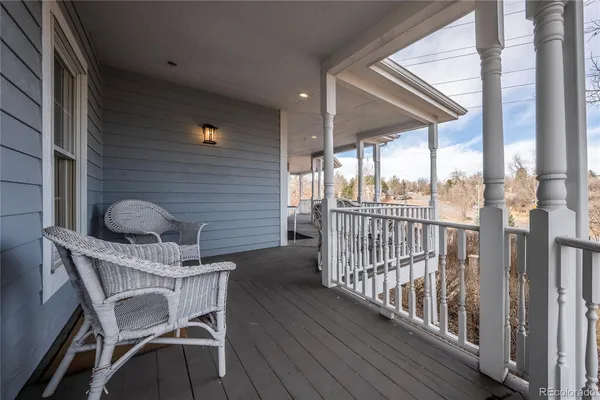 a view of a balcony with furniture