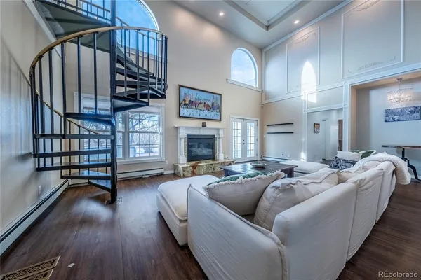a living room with furniture fireplace and a window