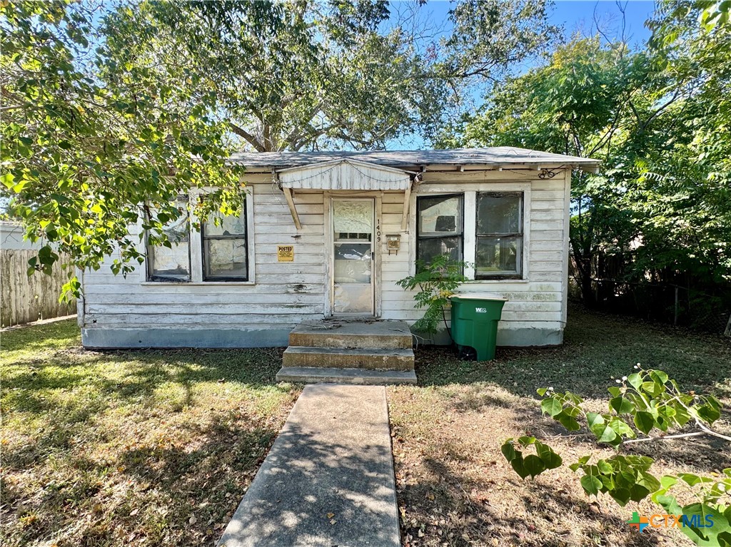 1409 East Commercial Street Victoria, TX 77901 - Photo 1 of 1 a front view of a house with a yard outdoor seating and yard