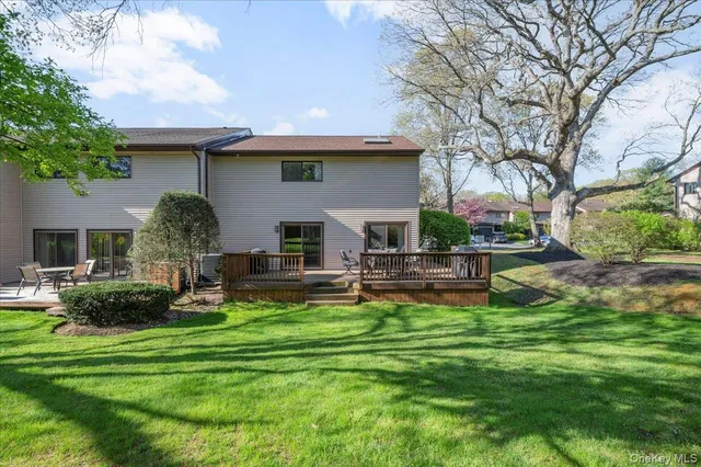 a front view of house with yard and outdoor seating