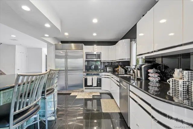 a kitchen with stainless steel appliances lots of counter top space