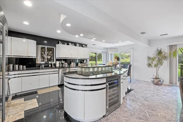 a kitchen with stainless steel appliances granite countertop a stove and a sink