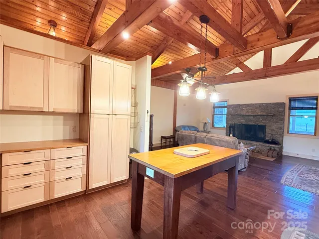 a kitchen with granite countertop sink and window