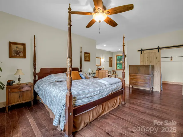 a living room with a furniture and a potted plant
