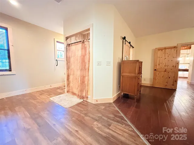 a bedroom with a bed and a table