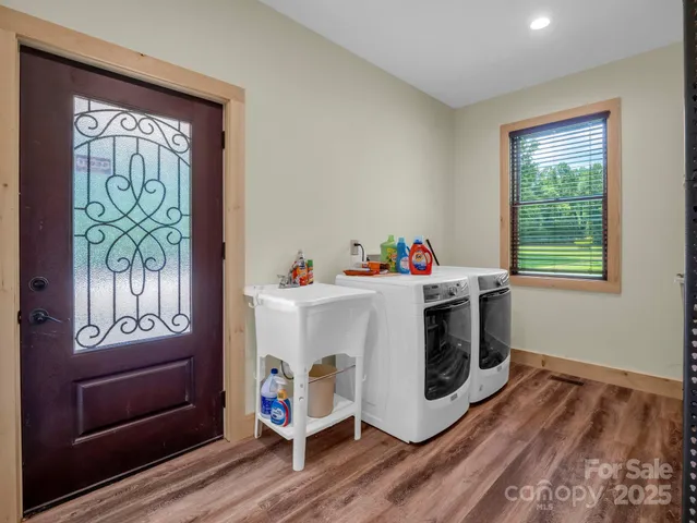 a view of a wooden deck next to a yard