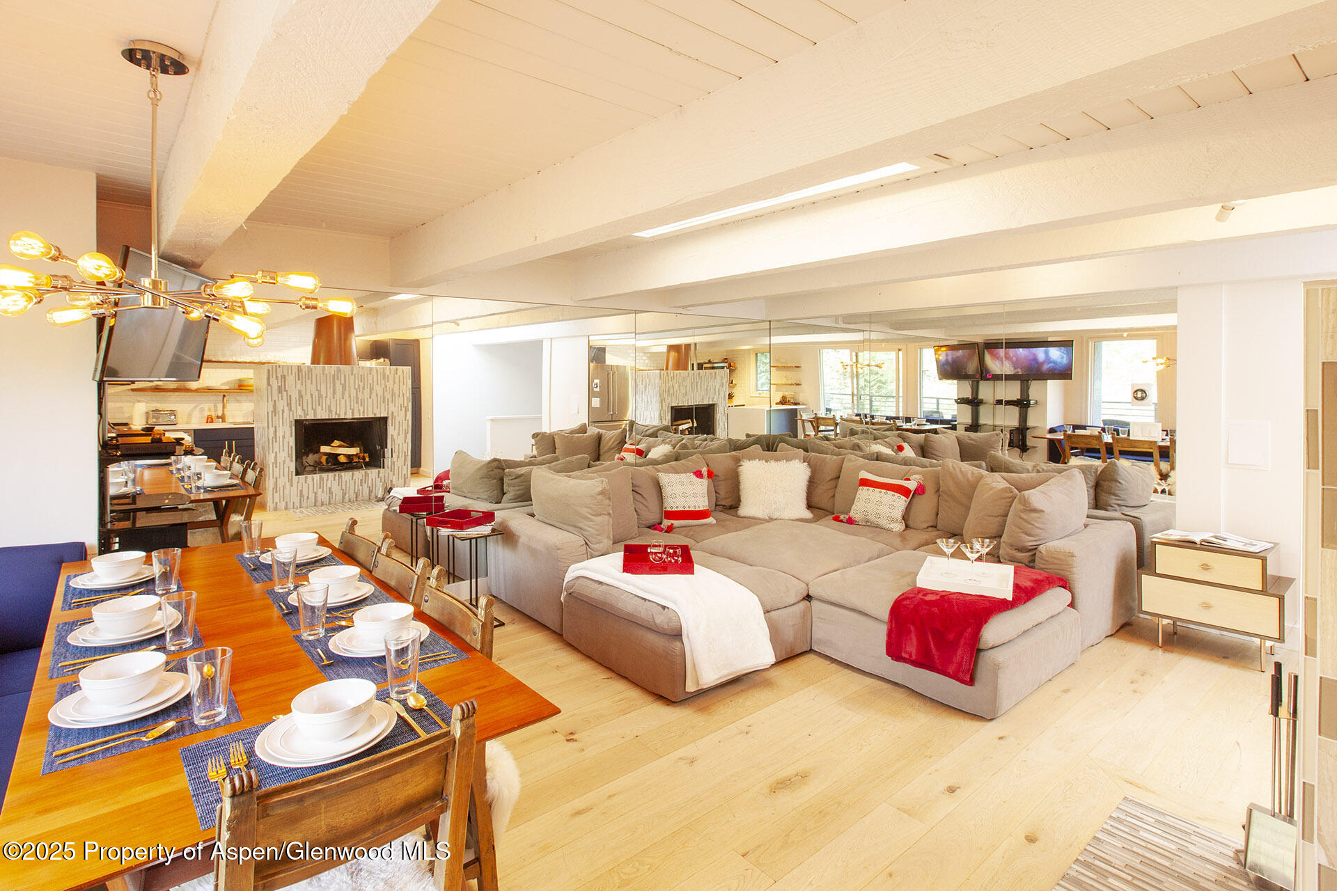 1039 East Cooper Avenue, Unit 16A Aspen, CO 81611 - Photo 1 of 37 a living room with furniture and a fireplace