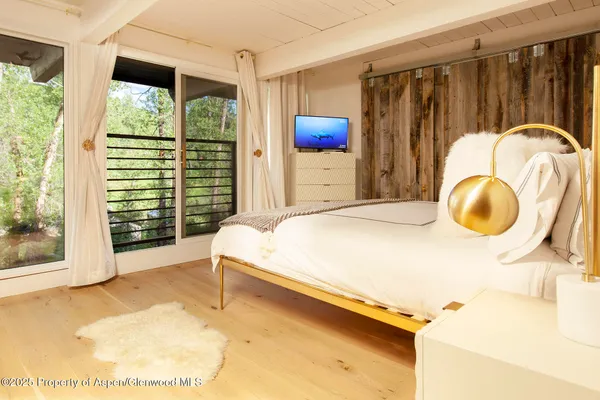 a bed room with a bed and a night stand