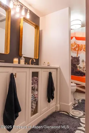a bathroom with a sink and mirror