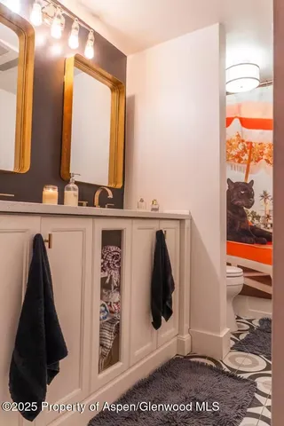 a bathroom with a sink and mirror