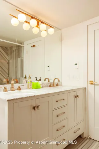 a view of a bathtub with window and a shower
