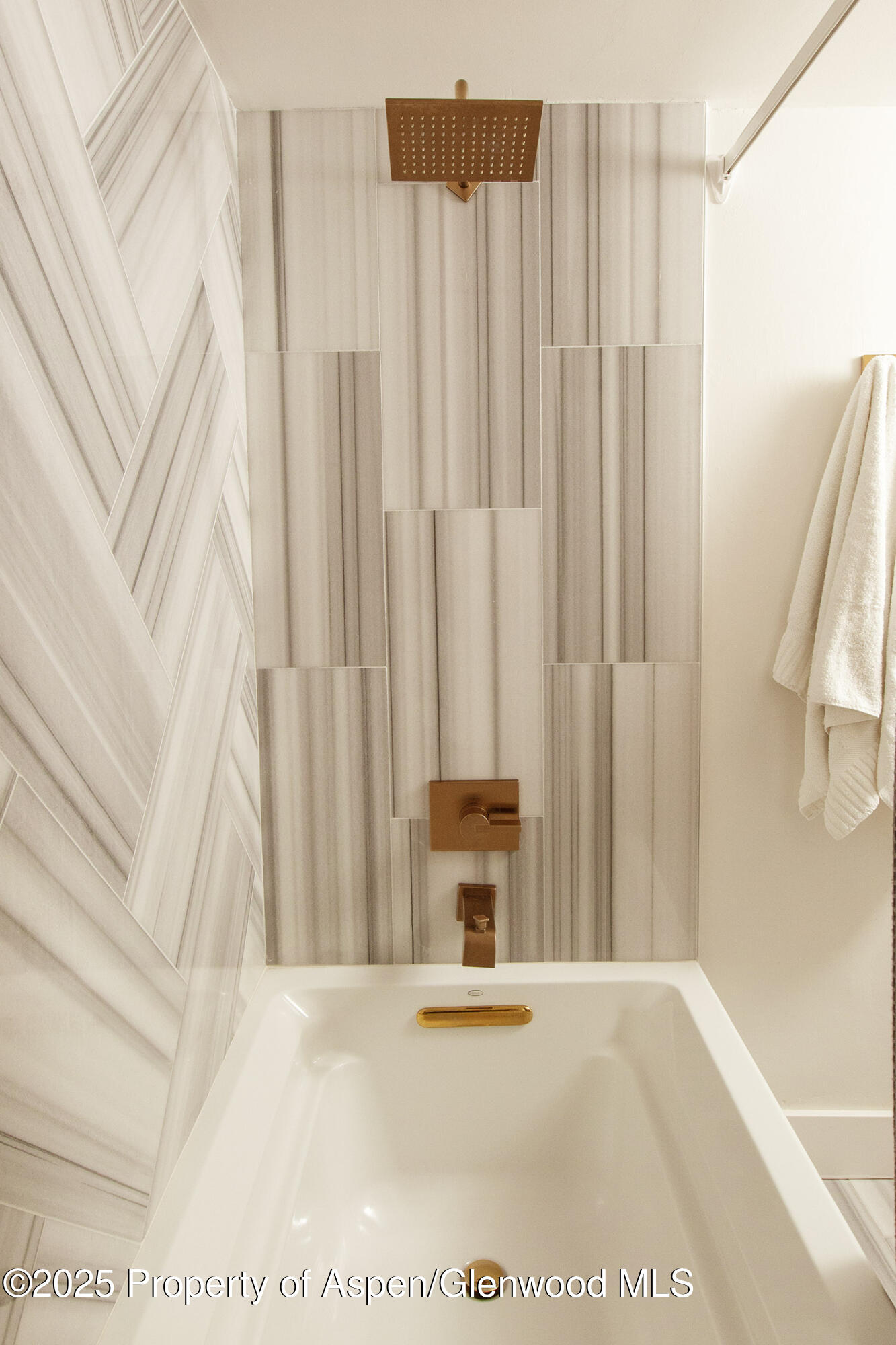 1039 East Cooper Avenue, Unit 16A Aspen, CO 81611 - Photo 27 of 37 a view of a bathtub with window and a shower