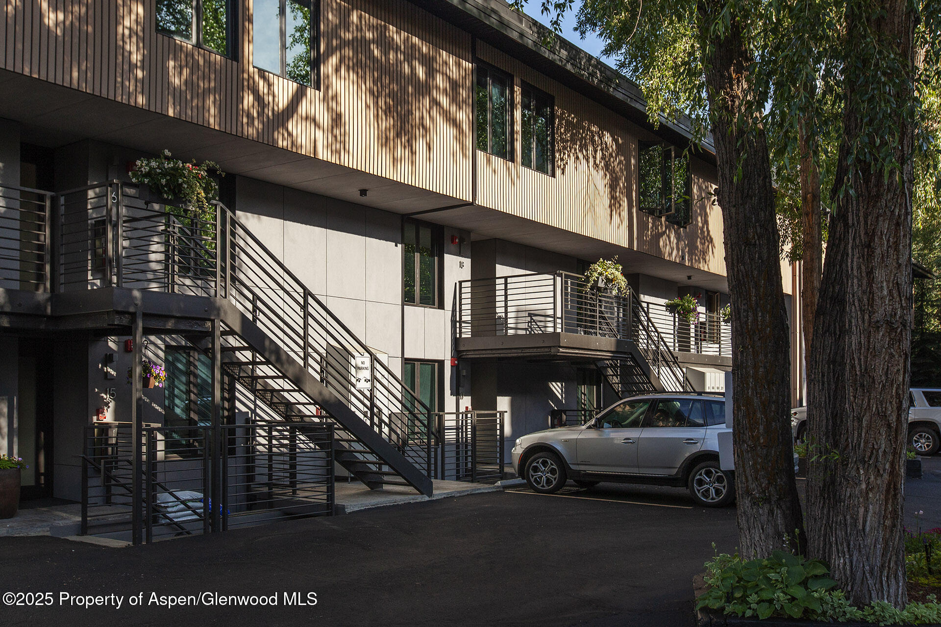 1039 East Cooper Avenue, Unit 16A Aspen, CO 81611 - Photo 36 of 37 a car parked in front of a house