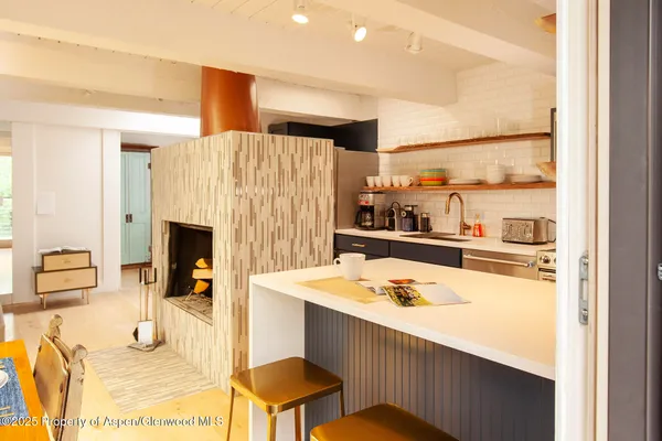 a dining table with kitchen view