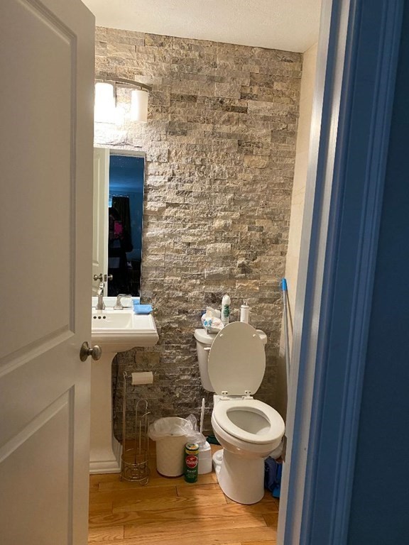 85 Littleton Road Ayer, MA 01432 - Photo 8 of 15 a bathroom with a toilet a sink and a mirror