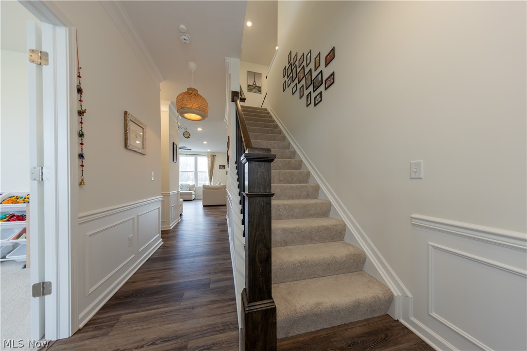 766 River Run Road Aurora, OH 44202 - Photo 5 of 49 Entrance foyer with wood finished floors and crown molding
