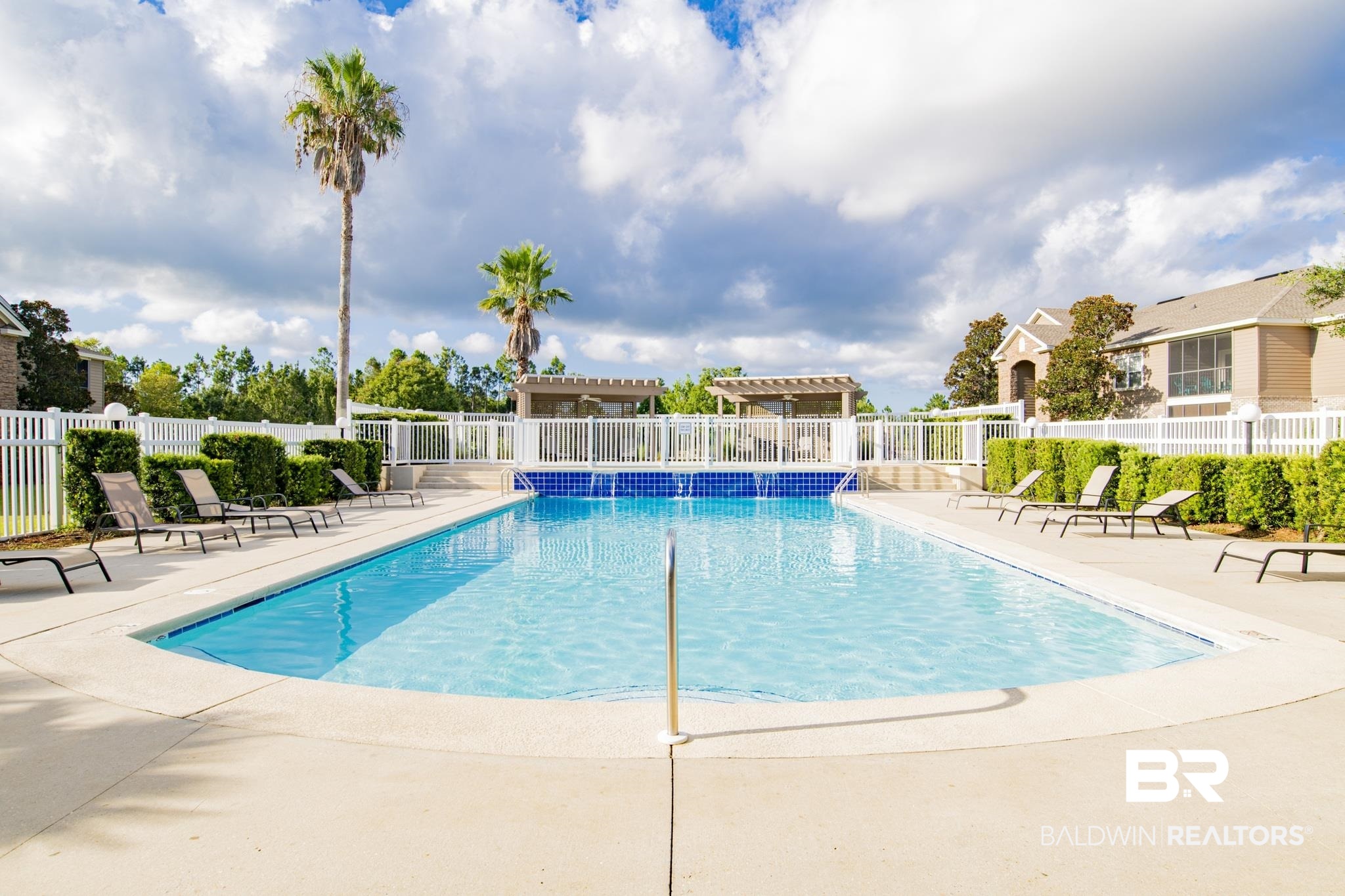 450 Park Avenue, Unit 202 Foley, AL 36535 - Photo 14 of 18 Community pool featuring a patio area